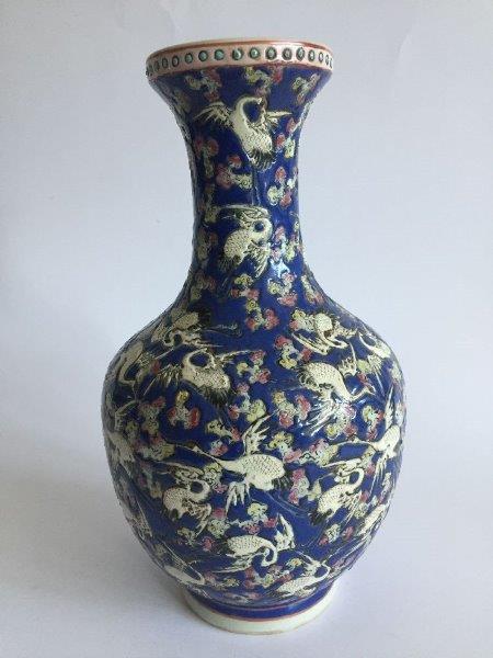 A pair of Chinese porcelain famille rose blue-ground 'cranes' vases, Republic period, painted with - Image 5 of 7