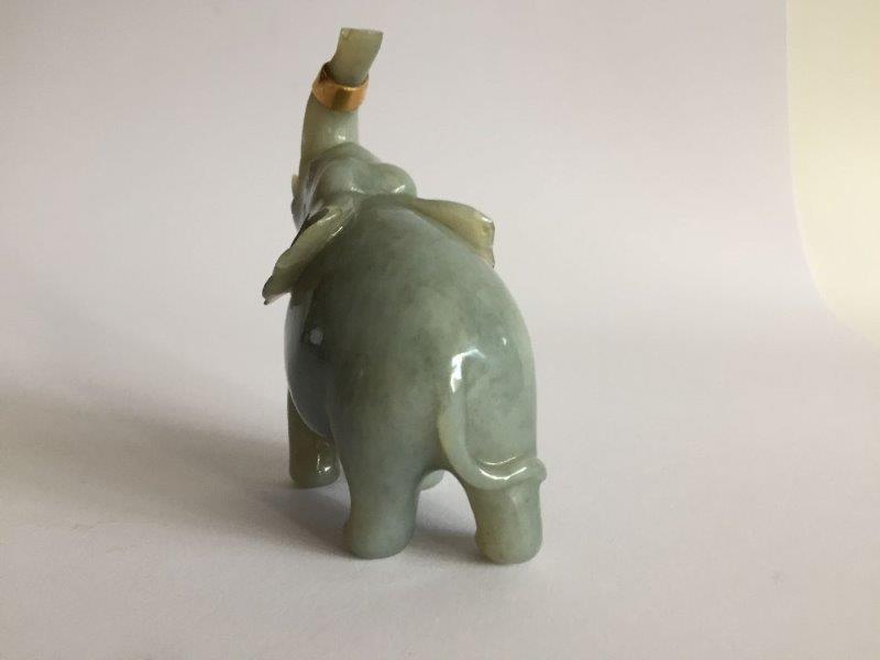 A Chinese jadeite figure of an elephant, early 20th century, carved with its head tilted back and - Image 4 of 6