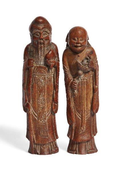 A pair of Chinese carved bamboo figures, early 19th century, one carved Shoulao holding a large