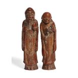 A pair of Chinese carved bamboo figures, early 19th century, one carved Shoulao holding a large