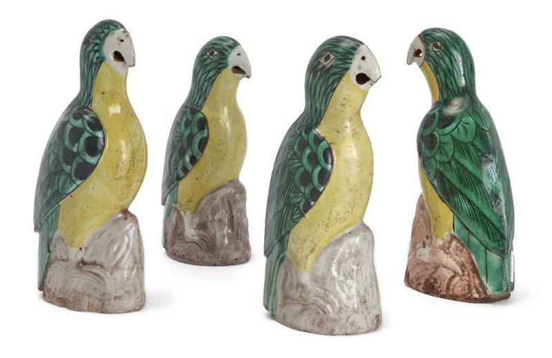 Four Chinese biscuit porcelain green and yellow-glazed figures of parrots, 18th century, modelled as