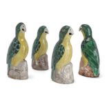 Four Chinese biscuit porcelain green and yellow-glazed figures of parrots, 18th century, modelled as