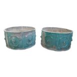 A Pair of lead planters, late 19th century, green painted with lion head motifs, 30cm high, 58cm