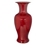 A Chinese porcelain monochrome copper-red baluster vase, late Qing dynasty/early Republic period,