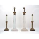 A pair of octagonal glass and brass Corinthian column table lamps, 20th century, on stepped bases,