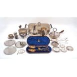 A quantity of silver plate including: a cased set of berry spoons and a sifting spoon, designed with