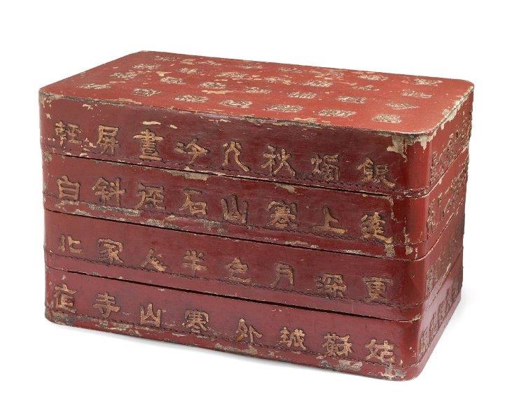 A Chinese lacquered wood three-tiered stacking box, 19th century, the cover and sides decorated with