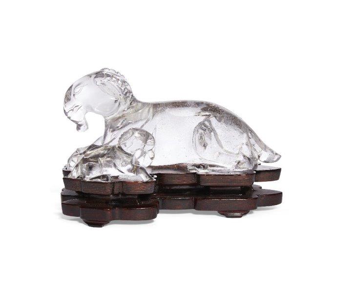 A Chinese rock crystal 'rams' figure group, early 20th century, carved as a recumbent ram and