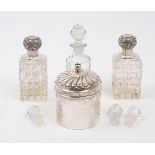 Two silver mounted glass vanity bottles, Birmingham, 1897, C. May & Sons, the rectangular cut