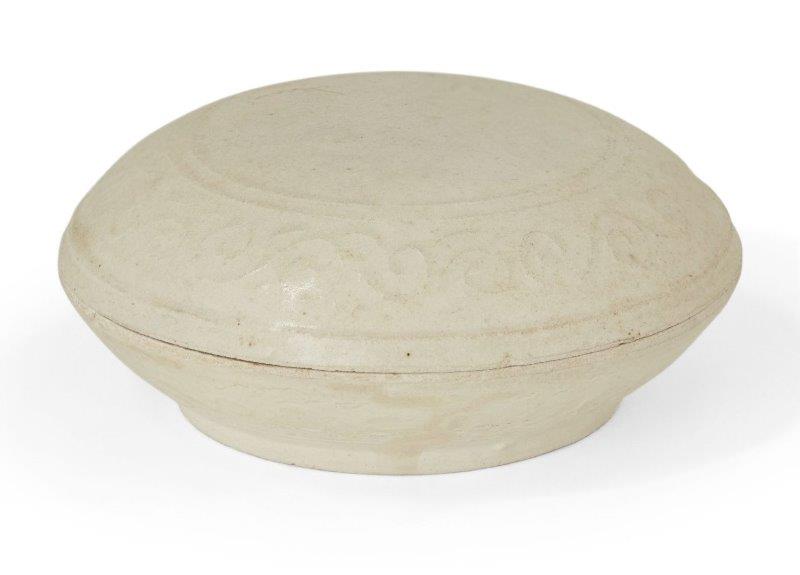 A Chinese porcelain circular box and cover, Yuan dynasty, the cover and base moulded with a band