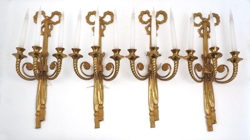 A set of four Regency style gilt bronze three-branch wall lights, 20th century, each with ribbon-
