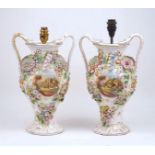 A pair of Continental floral encrusted twin handle vases, 20th century, each with a central
