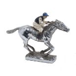 A silver plated model of a racehorse, with enamelled jockey in blue, white and black colours, 10.5cm