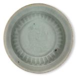A Chinese porcelain qingbai small dish, Song dynasty, with moulded design to the central reserve