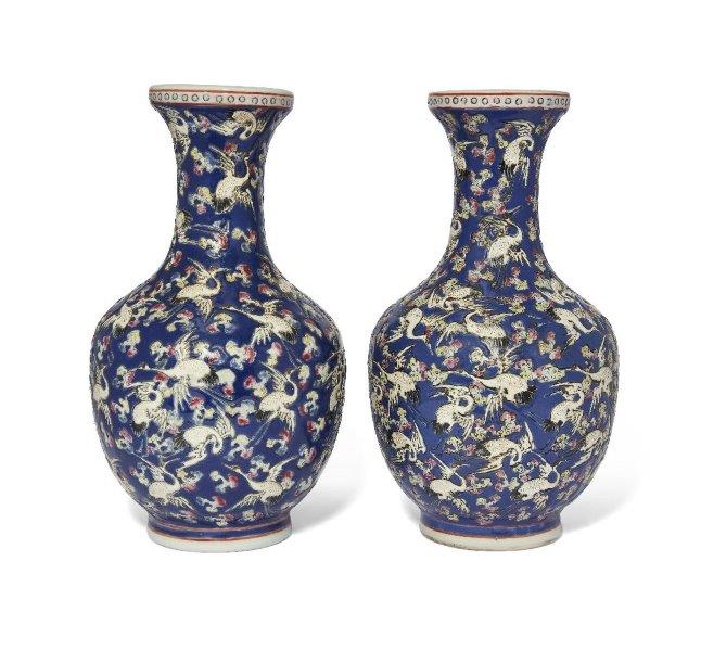 A pair of Chinese porcelain famille rose blue-ground 'cranes' vases, Republic period, painted with