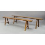 A French rustic oak bench, early to mid 20th Century, the rectangular seat with shaped ends on