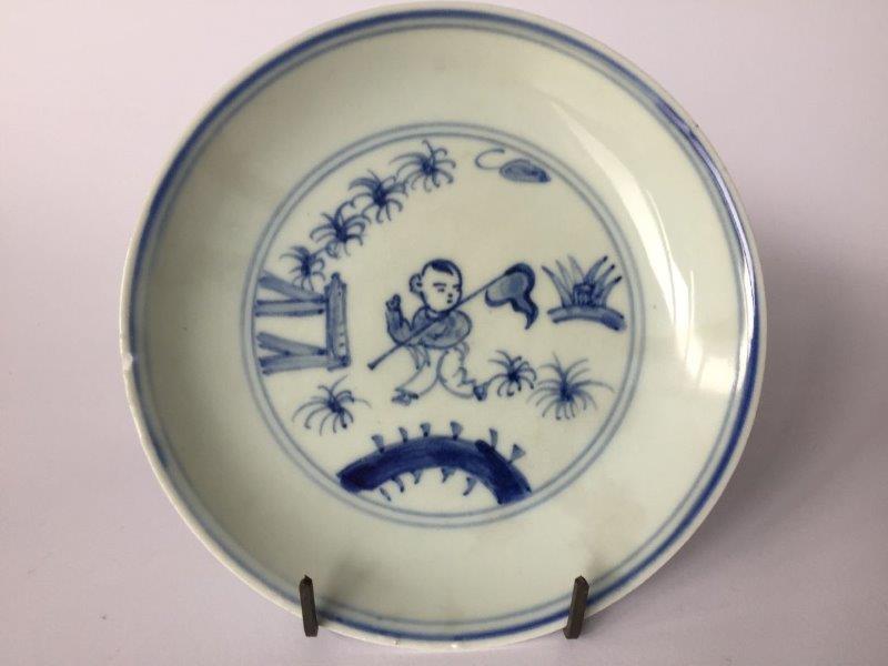 A Chinese porcelain blue and white 'boy' dish, 18th century, painted to the interior with a boy - Image 5 of 5