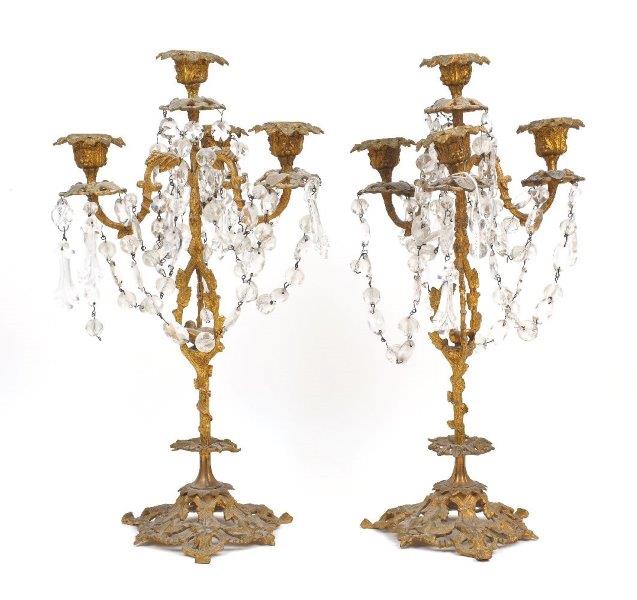 A pair of gilt metal four light candelabra, 19th century, modelled as flowering trees, with cut