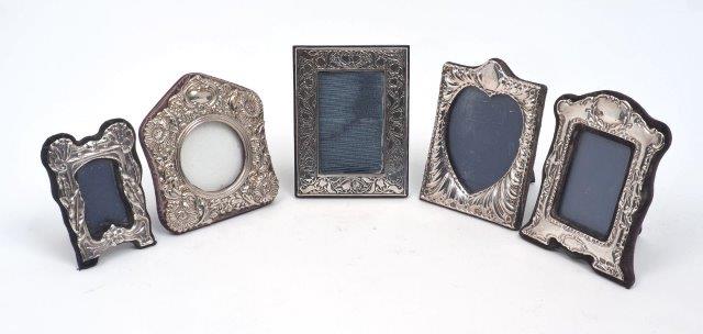 Four small silver mounted photo frames, including one with tulip decoration to border, London, 1987,