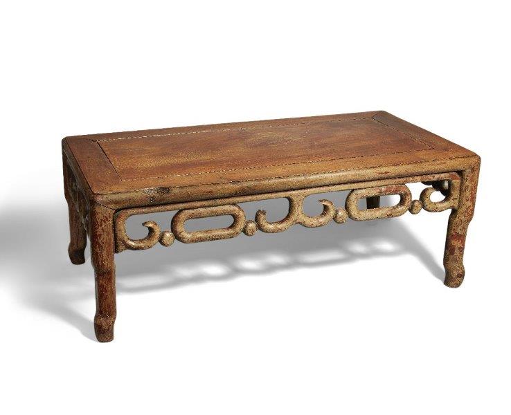 A Chinese huali wood low table, kang, 19th century, the rectangular top above scroll decorated