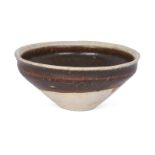 A Chinese Cizhou-type iron brown-glazed tea bowl, Northern Song dynasty, the conical bowl with a