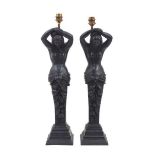 A pair of oak caryatid table lamps, 19th century and later, each in the form of a female with raised