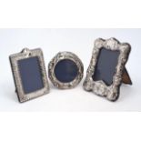 A silver mounted photo frame repousse decorated with putti and foliate scrolls, London, 1978, CJM,