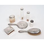 Four silver mounted vanity jars, London, 1911, WG, together with a square silver cigarette box,
