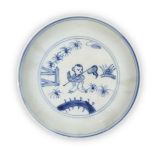 A Chinese porcelain blue and white 'boy' dish, 18th century, painted to the interior with a boy