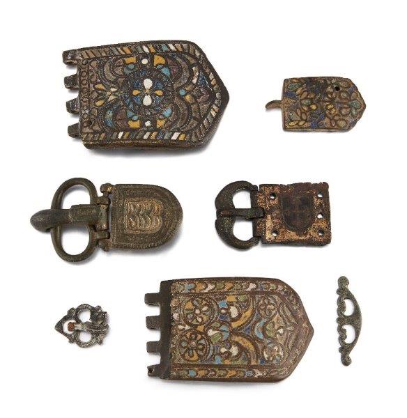 A group of Byzantine bronze buckles and fittings, some with yellow and blue enamel, 7th century