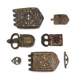 A group of Byzantine bronze buckles and fittings, some with yellow and blue enamel, 7th century