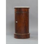 A Victorian mahogany pedestal cupboard, of cylindrical form, with marble top, raised on pedestal