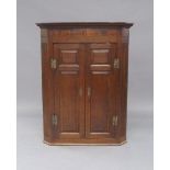 A George III oak corner cabinet, with Tunbridgeware inlay, 115cm high, 90cm wide, 46cm deepPlease