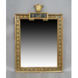 A North European giltwood and gesso mirror, c.1800, with foliate cresting, panel decorated with an