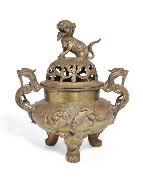 A Chinese polished bronze 'temple lion' tripod censer and cover, early 20th century, of compressed