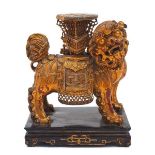 A Chinese giltwood figure of a temple lion, 20th century, modelled as a standing temple lion with