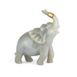 A Chinese jadeite figure of an elephant, early 20th century, carved with its head tilted back and