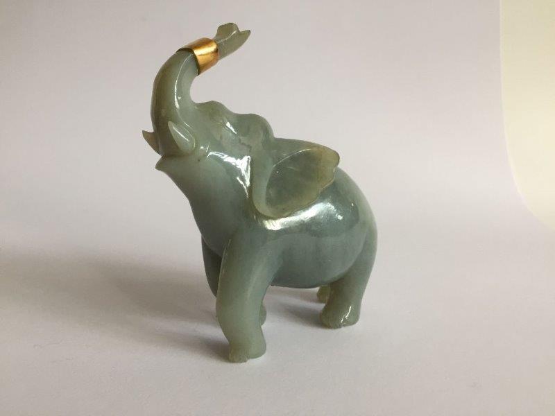 A Chinese jadeite figure of an elephant, early 20th century, carved with its head tilted back and - Image 3 of 6