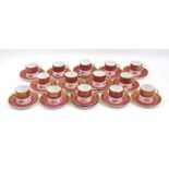 A set of twelve Hammersley coffee cans and saucers, 20t century, of cream and red ground with gilt