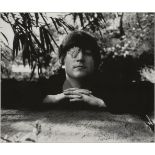 Robert Whitaker, British, 1939-2011- John Lennon with flower, Weybridge, 1965; photographic print in