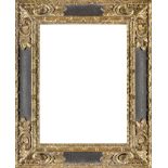 A Carved Parcel Gilded and Ebonised Spanish Style Frame, late 20th century, ( VAT charged on