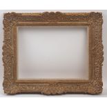 A Gilded Composition Louis XIV transitional Style Frame, 20th century, with added linen mounted