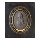 An English black basalt portrait relief of Admiral Lord Nelson, early 19th century, in a later