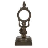 A Regency bronze figural pocket watch stand, early 19th century, modelled as a kneeling child