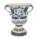 A Continental glazed pottery two-handled blue and white campana jardiniere, probably 19th century,