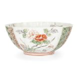 A French Kangxi-style porcelain famille verte lobed bowl, 19th century, on short foot with curving