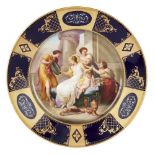 A Vienna-style porcelain cabinet plate, c.1900, blue beehive mark and title â€˜Schmuckung Der