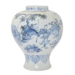 A Dutch Delft blue and white baluster vase, c.1700, painted with chinoiserie figures holding fans