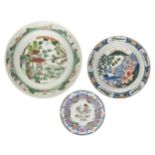 A Chinese export porcelain dish, a Famille verte charger, and a Delft plate, 18th-20th century,
