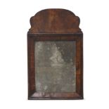 A George II walnut rectangular mirror, with scalloped shape crest, 64 x 39cm Please refer to